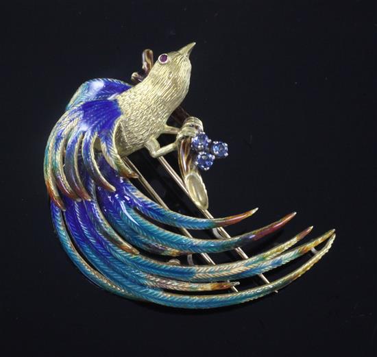 A modern gold, gem set and polychrome enamel brooch, modelled as a bird of paradise on a branch, 5cm.